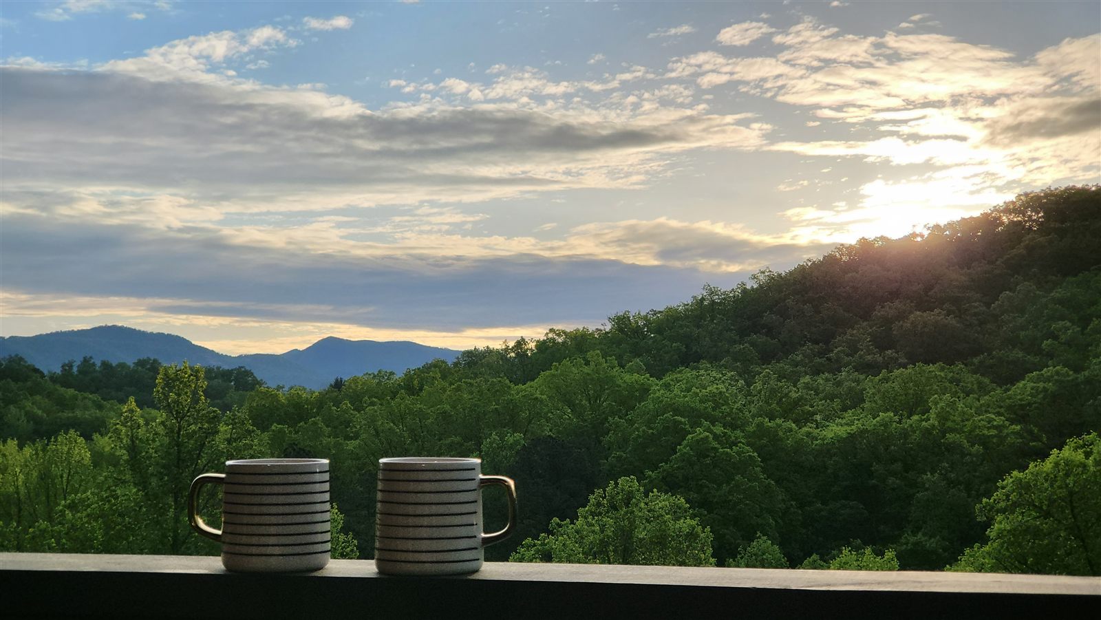 Morning coffee and a Smoky Mountain sunrise from a cabin porch